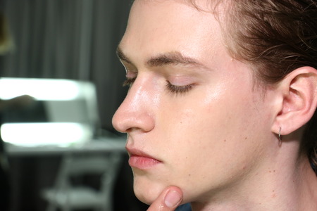NEW YORK, NY - FEBRUARY 04: A model getting ready backstage before  Siki Im Show during New York Fashion Week Men's Fall/Winter 2016 on February 4, 2016 in NYC.のeditorial素材