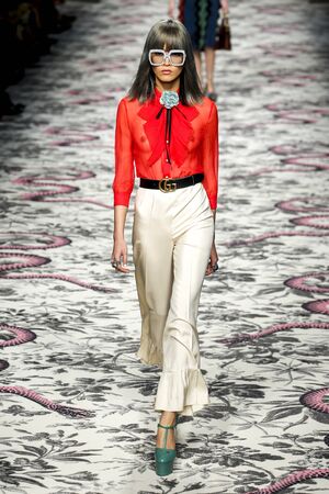 MILAN, ITALY - SEPTEMBER 23: A model walks the runway during the Gucci show as a part of Milan...