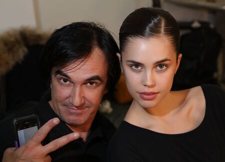 NEW YORK, NY - APRIL 14: Photographer Anton Oparin (L) and model posing backstage during the Anne Barge Bridal Spring/Summer 2017 Runway Show at Annex 38 on April 14, 2016 in New York City.のeditorial素材