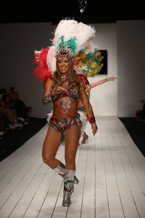 MIAMI, FL - JULY 16: Brazilian dancers performs on the runway during the CA-RIO-CA fashion show for...