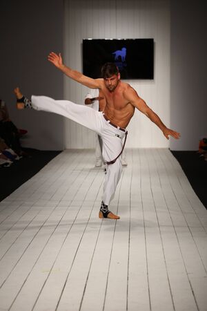 MIAMI, FL - JULY 16: Dancers performs capoeira on the runway during the CA-RIO-CA fashion show for Miami Swim Week on July 16, 2015のeditorial素材