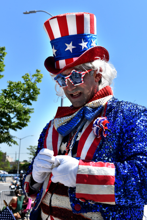 NEW YORK - JUNE 18, 2016: Participants march in the 34th Annual Mermaid Parade at Coney Island, the largest art parade in the nation and a celebration of ancient mythology on June 18, 2016 in Brooklyn NY.のeditorial素材