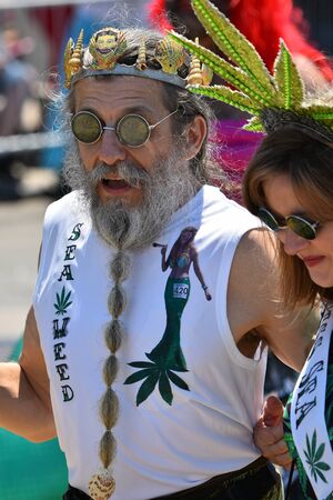 NEW YORK - JUNE 18, 2016: Participants march in the 34th Annual Mermaid Parade at Coney Island, the largest art parade in the nation and a celebration of ancient mythology on June 18, 2016 in Brooklyn NY.のeditorial素材
