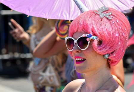 NEW YORK - JUNE 18, 2016: Participants march in the 34th Annual Mermaid Parade at Coney Island, the...