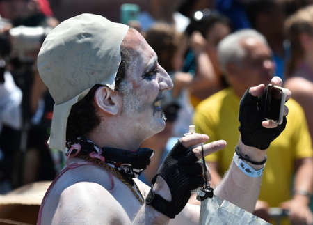 NEW YORK - JUNE 18, 2016: Participants march in the 34th Annual Mermaid Parade at Coney Island, the...