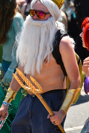 NEW YORK - JUNE 18, 2016: Participants march in the 34th Annual Mermaid Parade at Coney Island, the largest art parade in the nation and a celebration of ancient mythology on June 18, 2016 in Brooklyn NY.のeditorial素材