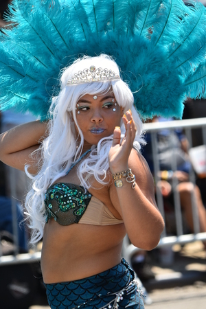 NEW YORK - JUNE 18, 2016: Participants march in the 34th Annual Mermaid Parade at Coney Island, the largest art parade in the nation and a celebration of ancient mythology on June 18, 2016 in Brooklyn NY.のeditorial素材
