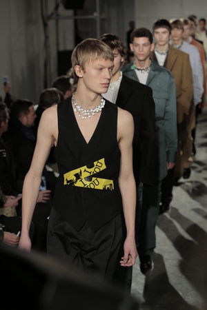 NEW YORK, NY - FEBRUARY 01: Models walk the runway finale at the Raf Simons fashion show during...