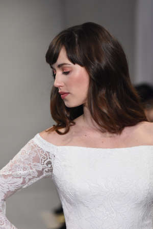 NEW YORK, NY - APRIL 20: A model walks the runway at the Theia show during New York Fashion Week: Bridal at the Theia Showroom on April 20, 2017 in New York City.のeditorial素材