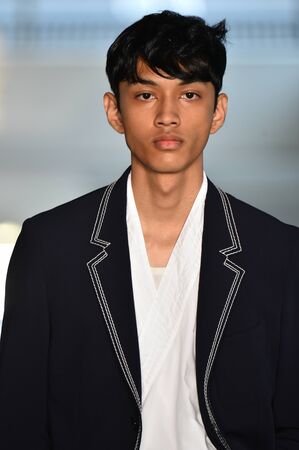 NEW YORK, NY - JULY 11: A model walks the runway at the BOSS - Hugo Boss show during NYFW Mens...