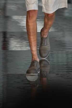 NEW YORK, NY - JULY 11: A model walks the runway at the BOSS - Hugo Boss show during NYFW Mens Spring Summer 2018 at 11 Fulton street on July 11, 2017 in New York City.のeditorial素材