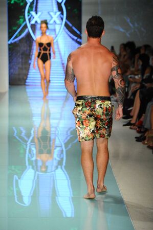 MIAMI, FL - JULY 20: A model walks the runway during Mr Tripple X  fashion show for Funkshion Miami Swim Week on July 20, 2017.のeditorial素材
