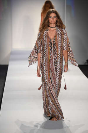 MIAMI BEACH, FL - JULY 23: A model walks the runway at SWIMMIAMI Indah 2018 Collection at SWIMMIAMI...
