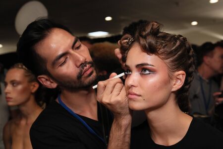 NEW YORK, NY - SEPTEMBER 09: A model getting ready backstage for the Philipp Plein fashion show during New York Fashion Week: The Shows at Hammerstein Ballroom on September 9, 2017 in New York City.のeditorial素材