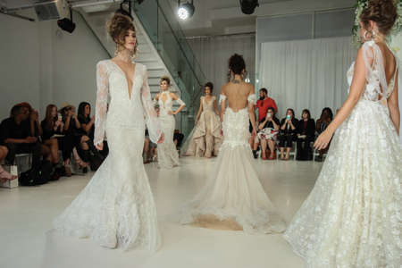 New York, NY, USA - October 7, 2017: Models walk the runway finale  for Julie Vino Havana 2018 Bridal Collection runway show at 404 10th Avenue during New York Bridal week, New York City.のeditorial素材