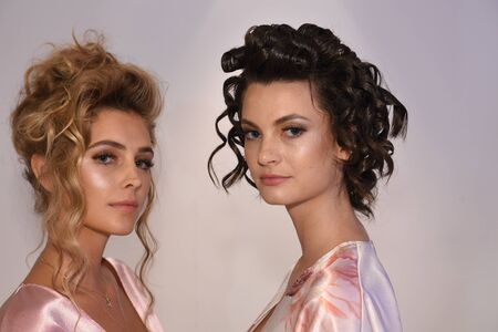 New York, NY, USA - October 7, 2017: Models posing backstage before  Julie Vino Havana 2018 Bridal Collection runway show at 404 10th Avenue during New York Bridal week, New York City.のeditorial素材