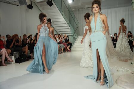 New York, NY, USA - October 7, 2017: Models walk the runway finale  for Julie Vino Havana 2018 Bridal Collection runway show at 404 10th Avenue during New York Bridal week, New York City.のeditorial素材