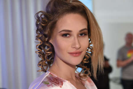 New York, NY, USA - October 7, 2017: A model posing backstage before  Julie Vino Havana 2018 Bridal Collection runway show at 404 10th Avenue during New York Bridal week, New York City.のeditorial素材