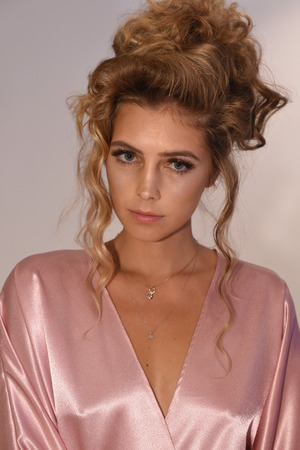 New York, NY, USA - October 7, 2017: A model posing backstage before  Julie Vino Havana 2018 Bridal Collection runway show at 404 10th Avenue during New York Bridal week, New York City.のeditorial素材