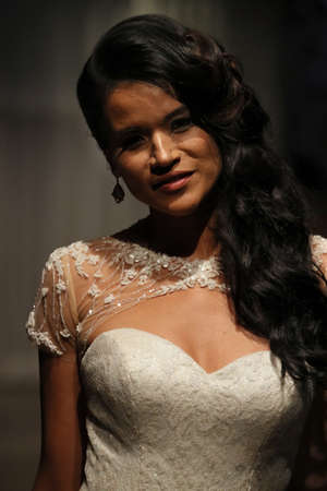 NEW YORK, NY - OCTOBER 04: A model walks the runway wearing Matthew Christopher dresses at NY Bridal Fashion Week at Punto Space 325 W 38th street on October 04, 2017 in New York City.のeditorial素材