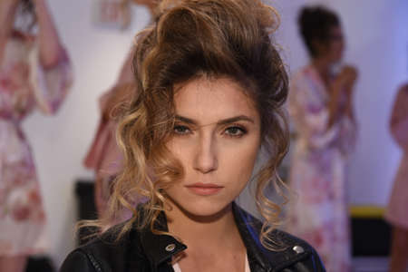 New York, NY, USA - October 7, 2017: A model posing backstage before  Julie Vino Havana 2018 Bridal Collection runway show at 404 10th Avenue during New York Bridal week, New York City.のeditorial素材