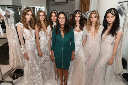 New York, NY, USA - October 6, 2017: Designer Berta Balilti  and models posing backstage before Berta Bridal 2018 Collection runway show during New York Bridal week, New York City.のeditorial素材