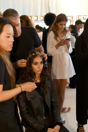 New York, NY, USA - October 6, 2017: A model getting ready backstage before Berta Bridal 2018 Collection runway show during New York Bridal week, New York City.のeditorial素材