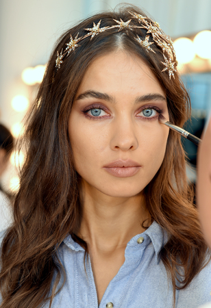 New York, NY, USA - October 6, 2017: A model getting ready backstage before Berta Bridal 2018 Collection runway show during New York Bridal week, New York City.のeditorial素材