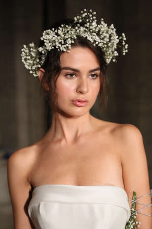 NEW YORK - OCTOBER 5: A model posing after Reem Acra  Bridal show Fall/Winter 2018 Collection during Bridal Fashion Week on October 5, 2017 in New York City.のeditorial素材