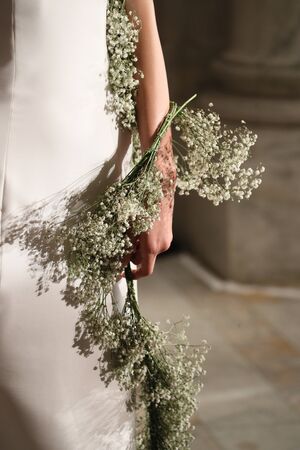 NEW YORK - OCTOBER 5: A model posing after Reem Acra  Bridal show Fall/Winter 2018 Collection during Bridal Fashion Week on October 5, 2017 in New York City.のeditorial素材