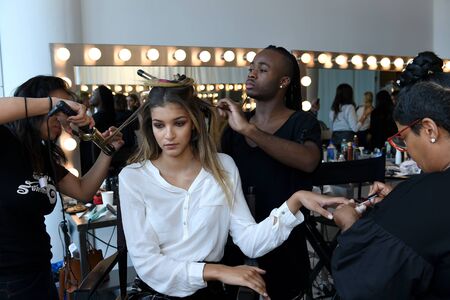 New York, NY, USA - October 6, 2017: A model getting ready backstage before Berta Bridal 2018...