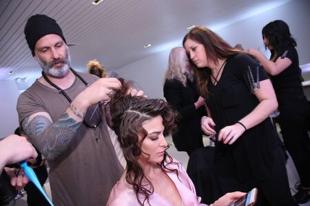 New York, NY, USA - October 7, 2017: A model getting ready backstage before  Julie Vino Havana 2018 Bridal Collection runway show at 404 10th Avenue during New York Bridal week, New York City.のeditorial素材