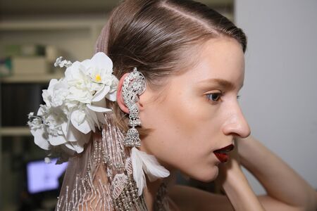 New York, NY, USA - October 6, 2017: A model posing backstage before the Naeem Khan Bridal 2018 Collection runway show during New York Bridal week, New York City.のeditorial素材