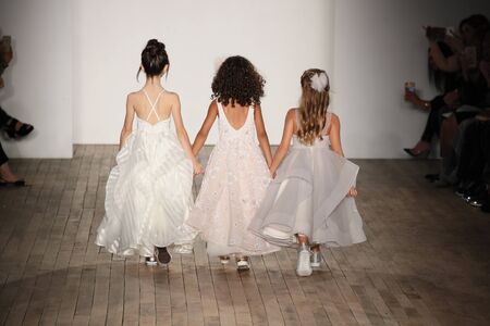 NEW YORK - OCTOBER 6: Kid models walk the runway for Blush by Hayley Paige  Bridal show Fall/Winter 2018 Collection during Bridal Fashion Week on October 6, 2017 in New York City.のeditorial素材