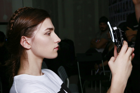 MILAN, ITALY - SEPTEMBER 23: A model is seen backstage ahead of the Jil Sander show during Milan Fashion Week Spring/Summer 2018 on September 23, 2017 in Milan, Italy.のeditorial素材