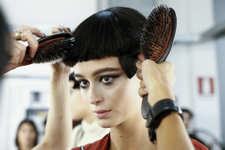MILAN, ITALY - SEPTEMBER 22: A model getting ready backstage before the Giorgio Armani show during Milan Fashion Week Spring/Summer 2018 on September 22, 2017 in Milan, Italy.のeditorial素材
