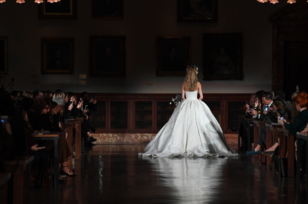 NEW YORK, NY - APRIL 12: A model walks the runway wearing Reem Acra Spring 2019 Bridal Collection at the New York Public Library on April 12, 2018 in New York City.のeditorial素材