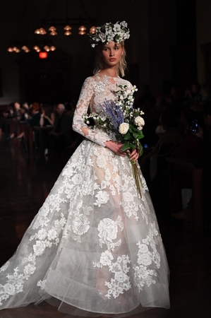 NEW YORK, NY - APRIL 12: A model walks the runway wearing Reem Acra Spring 2019 Bridal Collection at the New York Public Library on April 12, 2018 in New York City.のeditorial素材