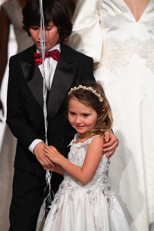 NEW YORK, NY - APRIL 12: Models walk the runway finale during the Oleg Cassini Spring 2019  Bridal fashion show on April 12, 2018 in New York City.のeditorial素材