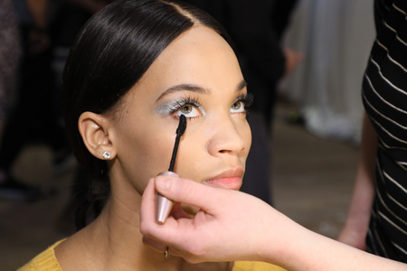 NEW YORK, NY - APRIL 13: A model getting ready before the Berta Bridal Spring 2019  Fashion show on April 13, 2018 in New York City.のeditorial素材
