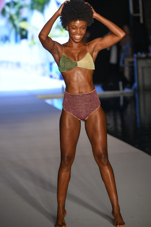 MIAMI, FL - JULY 15: A model walks the runway for the 2018 Sports Illustrated Swimsuit show at PARAISO during Miami Swim Week at The W Hotel South Beach on July 15, 2018 in Miami, Florida.のeditorial素材