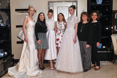 NEW YORK, NY - APRIL 10: Models, designer Gracy Accad (C) and Atelier PR staff prosing during the Gracy Accad Spring 2020 bridal presentation at Blumingdales on April 10, 2019 in NYC.のeditorial素材