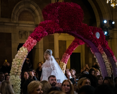 NEW YORK, NY - APRIL 11: A model walks the runway  during the Reem Acra Bridal Spring 2020 fashion...
