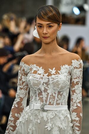 NEW YORK, NY - OCTOBER 4: Models walk the runway finale during the Pnina Tornai Fall 2020 Bridal Runway Show on OCTOBER 4, 2019 in New York City.のeditorial素材