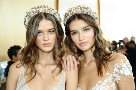 NEW YORK, NY - OCTOBER 5: Models posing backstage before  the Berta Fall 2020 Bridal Runway Show on OCTOBER 5, 2019 in New York City.のeditorial素材