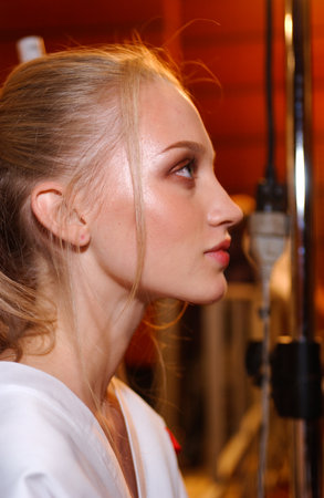 ARIS FRANCE - OCTOBER 10, 2004 Model Maria Dvirnik getting ready backstage for fashion show of Yalentino Ready-To-Wear collection during Paris Spring-Summer 2005 fashion week. Paris, 
October 10, 2004.のeditorial素材