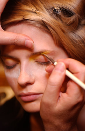 PARIS FRANCE - OCTOBER 12, 2003 Model Julia Stegner getting ready backstage for runway fashion show of Yalentino Ready-To-Wear collection during Paris Spring Summer 2004 fashion week. Paris, 
October 12, 2003.のeditorial素材