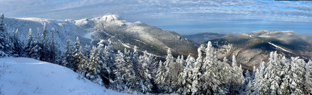 Panoramic mountain view of beautiful mountain peaks at snow day on the top of Stowe Mountain Ski resort, Vermont - December 2020のeditorial素材