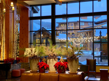 Christmas decorated Interiors of Empty Stowe Mountain resort Spruce peak village at evening time early December 2020 Vermont, USAのeditorial素材