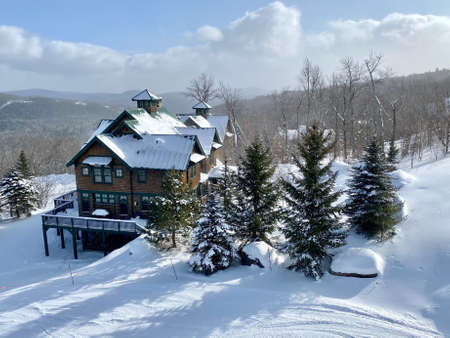 Slopeside condos at Okemo mountain ski resort with fresh snow in Vermont USA